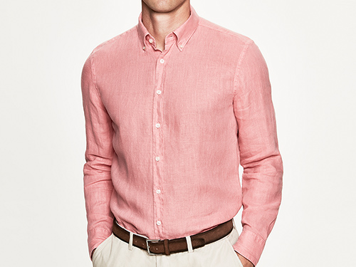 man in pink shirt with brown belt