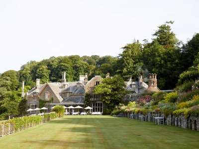 man in pink shirt with brown belt